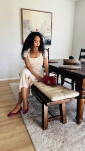 a beautiful woman sitting at a dining table